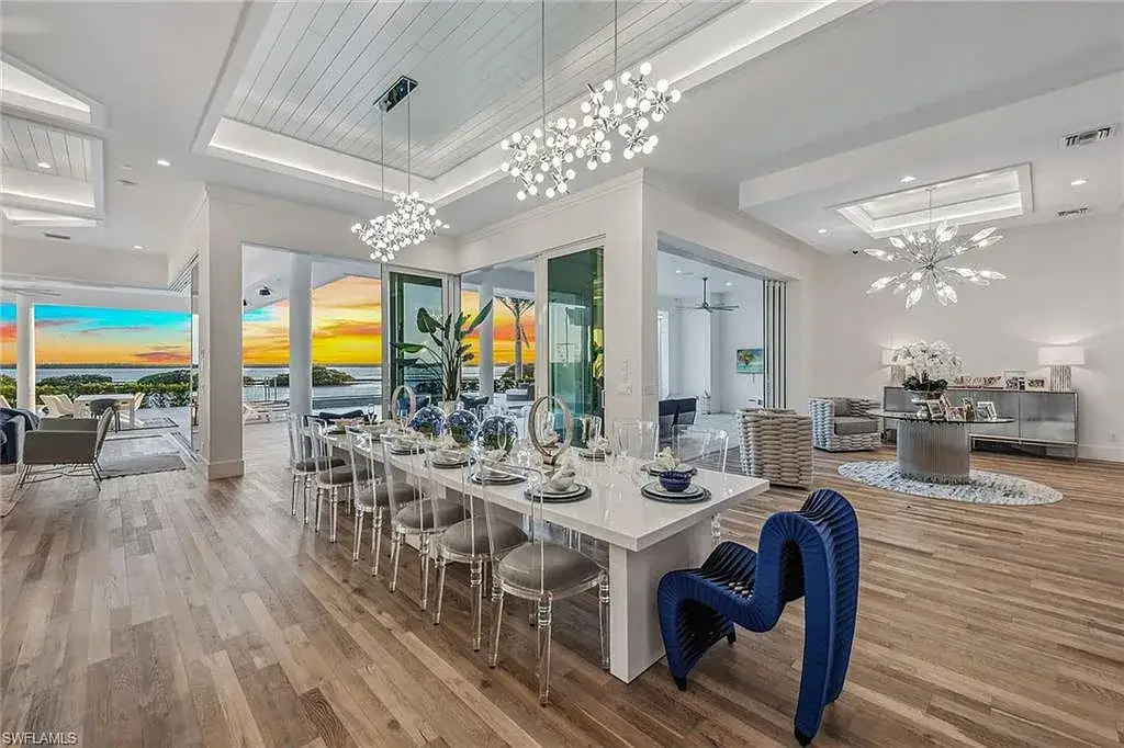 Stunning waterfront estate at 1829 S Inlet Dr, Marco Island, featuring a contemporary coastal design with panoramic Gulf views and lush tropical landscaping.