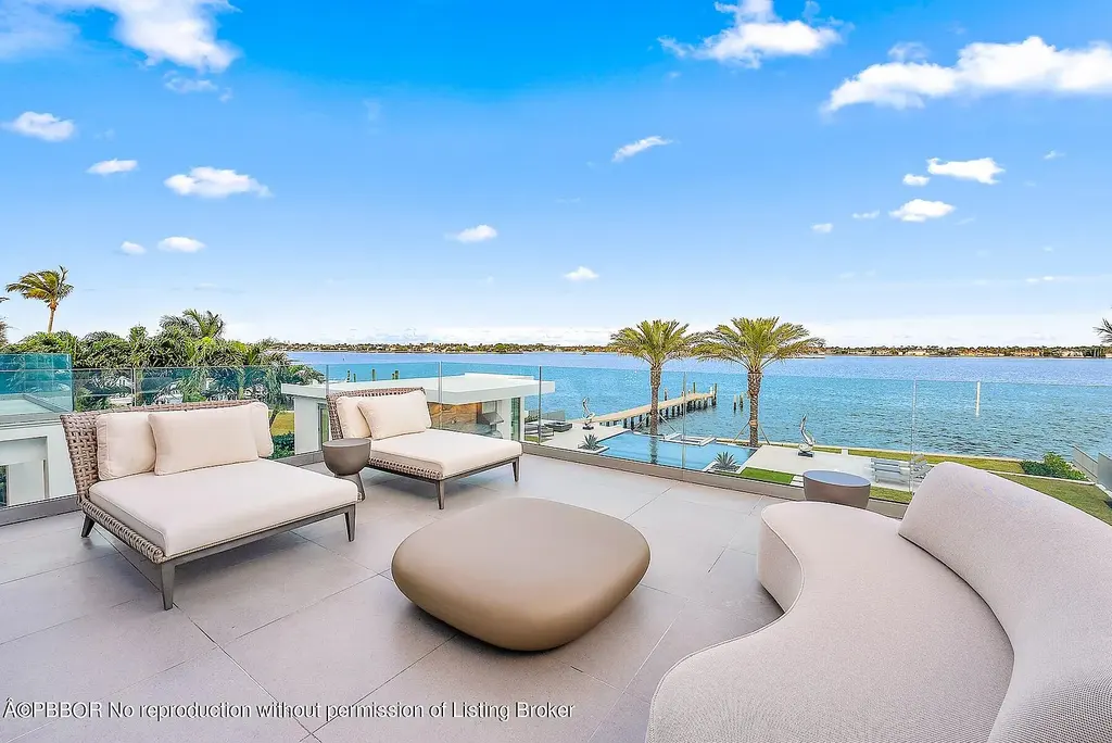 3030 Washington Rd, a $30.9M waterfront luxury home in West Palm Beach, featuring a saltwater pool, glass elevator, rooftop lounge, and breathtaking Intracoastal views.