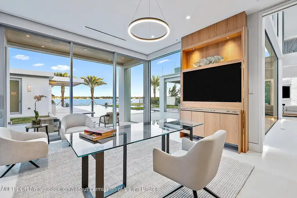 3030 Washington Rd, a $30.9M waterfront luxury home in West Palm Beach, featuring a saltwater pool, glass elevator, rooftop lounge, and breathtaking Intracoastal views.