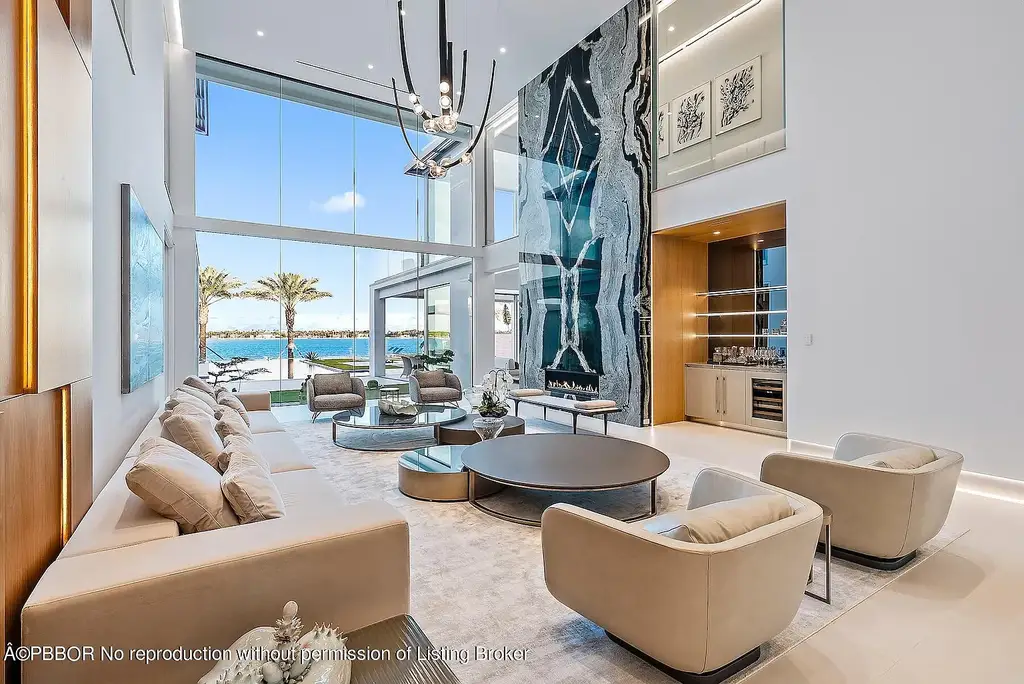 3030 Washington Rd, a $30.9M waterfront luxury home in West Palm Beach, featuring a saltwater pool, glass elevator, rooftop lounge, and breathtaking Intracoastal views.