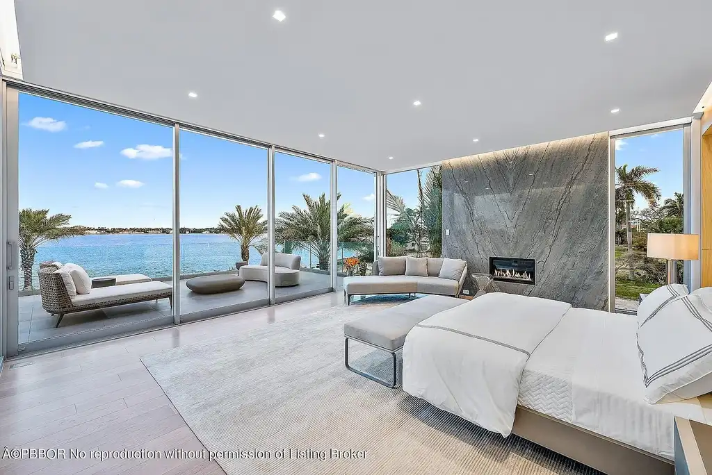 3030 Washington Rd, a $30.9M waterfront luxury home in West Palm Beach, featuring a saltwater pool, glass elevator, rooftop lounge, and breathtaking Intracoastal views.