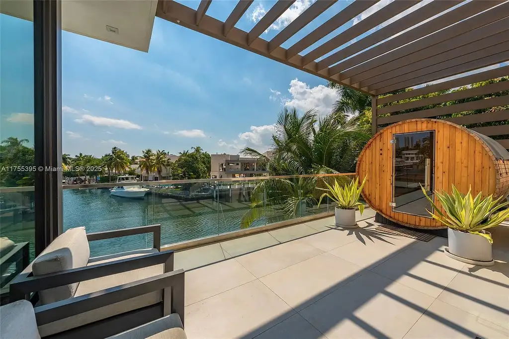 Elegant six-bedroom estate in Eastern Shores, North Miami Beach, with breathtaking water views and premium amenities.