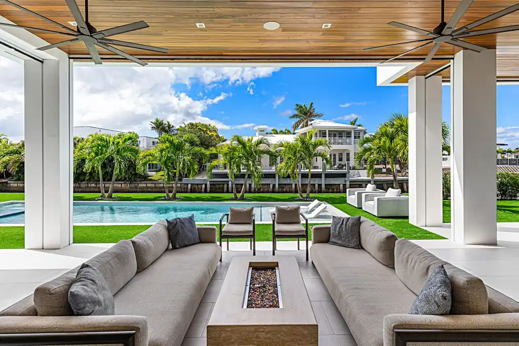 989 Marble Way, a $15.5M luxury waterfront estate in Boca Raton, featuring British West Indies-inspired architecture, Intracoastal access, and resort-style amenities.