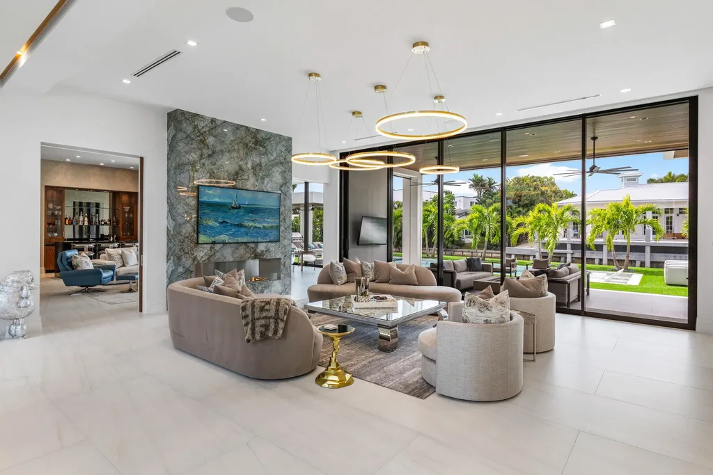 989 Marble Way, a $15.5M luxury waterfront estate in Boca Raton, featuring British West Indies-inspired architecture, Intracoastal access, and resort-style amenities.