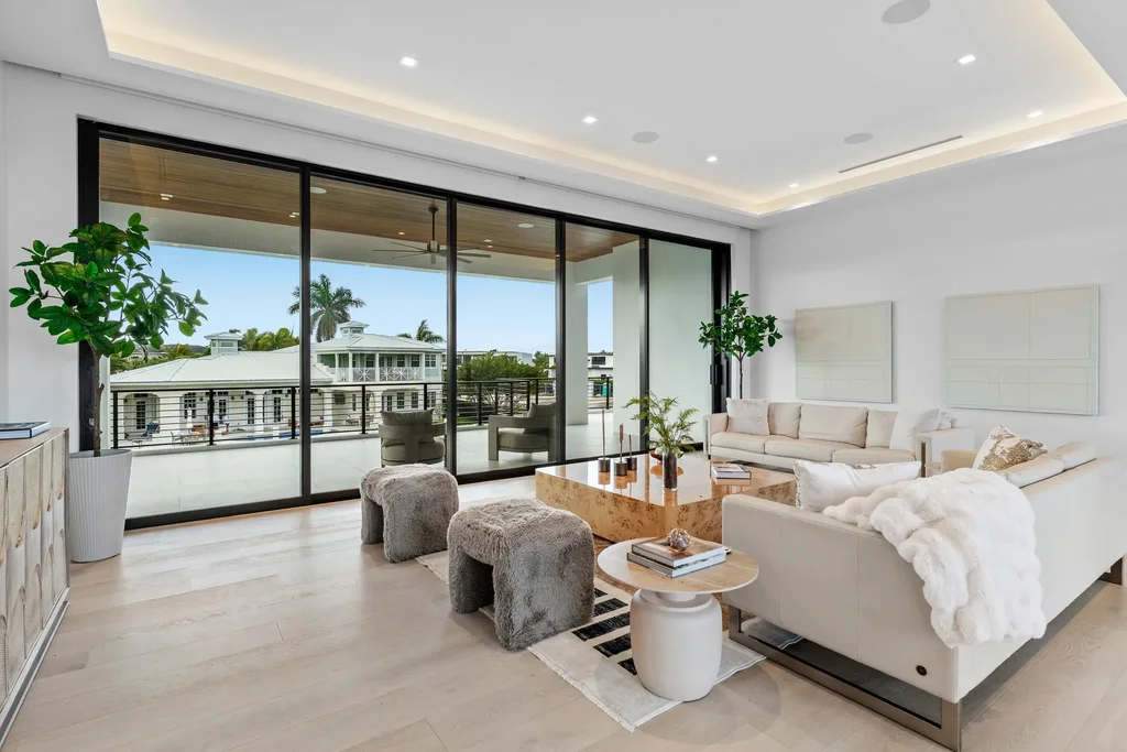 989 Marble Way, a $15.5M luxury waterfront estate in Boca Raton, featuring British West Indies-inspired architecture, Intracoastal access, and resort-style amenities.