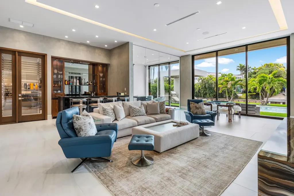 989 Marble Way, a $15.5M luxury waterfront estate in Boca Raton, featuring British West Indies-inspired architecture, Intracoastal access, and resort-style amenities.