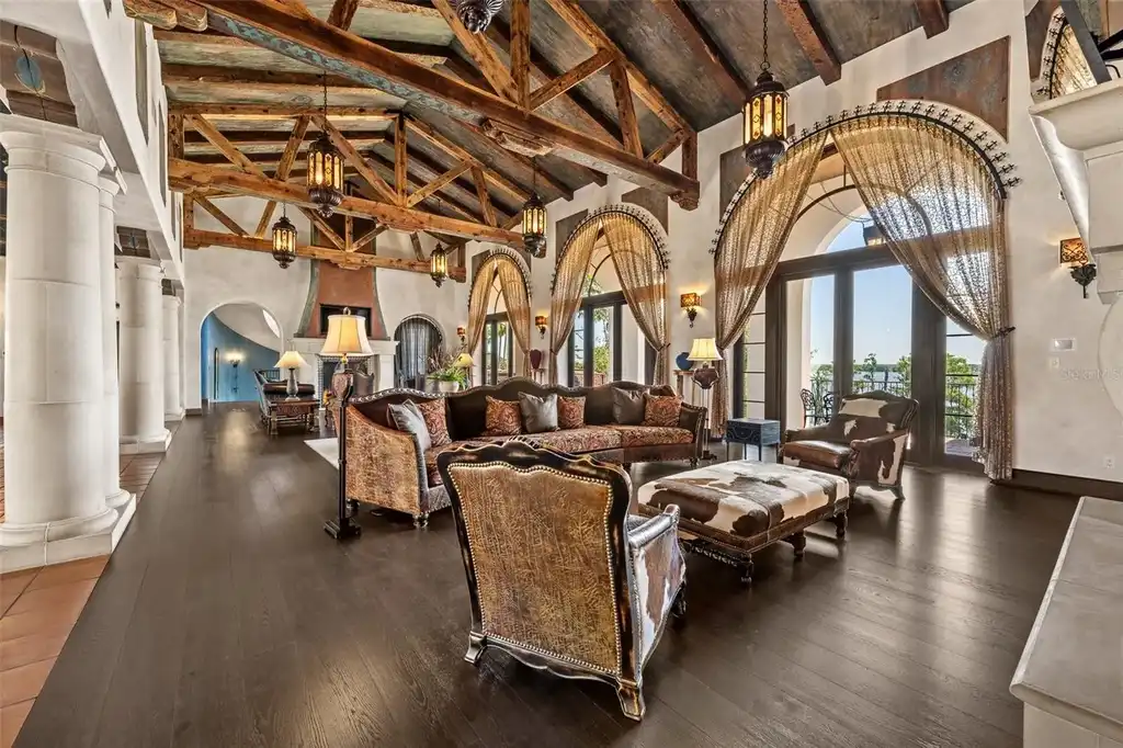 Luxury lakefront estate at 11865 Fort King Hwy in Thonotosassa, Florida, featuring Mediterranean architecture, private dock, Oval Office replica, and tiered pool.