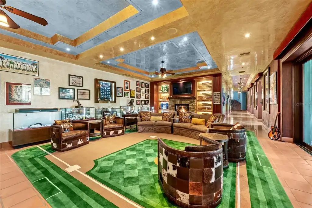 Luxury lakefront estate at 11865 Fort King Hwy in Thonotosassa, Florida, featuring Mediterranean architecture, private dock, Oval Office replica, and tiered pool.