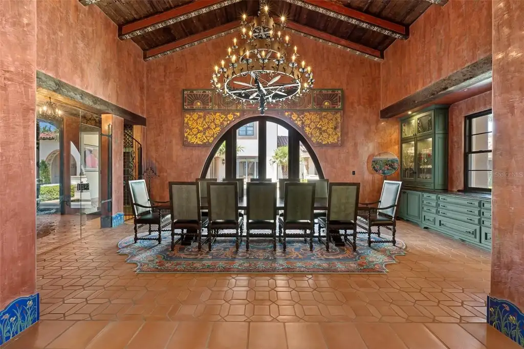 Luxury lakefront estate at 11865 Fort King Hwy in Thonotosassa, Florida, featuring Mediterranean architecture, private dock, Oval Office replica, and tiered pool.