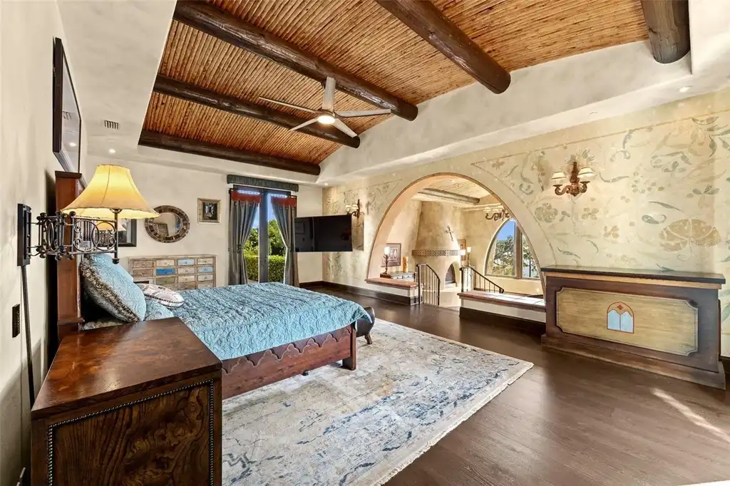 Luxury lakefront estate at 11865 Fort King Hwy in Thonotosassa, Florida, featuring Mediterranean architecture, private dock, Oval Office replica, and tiered pool.