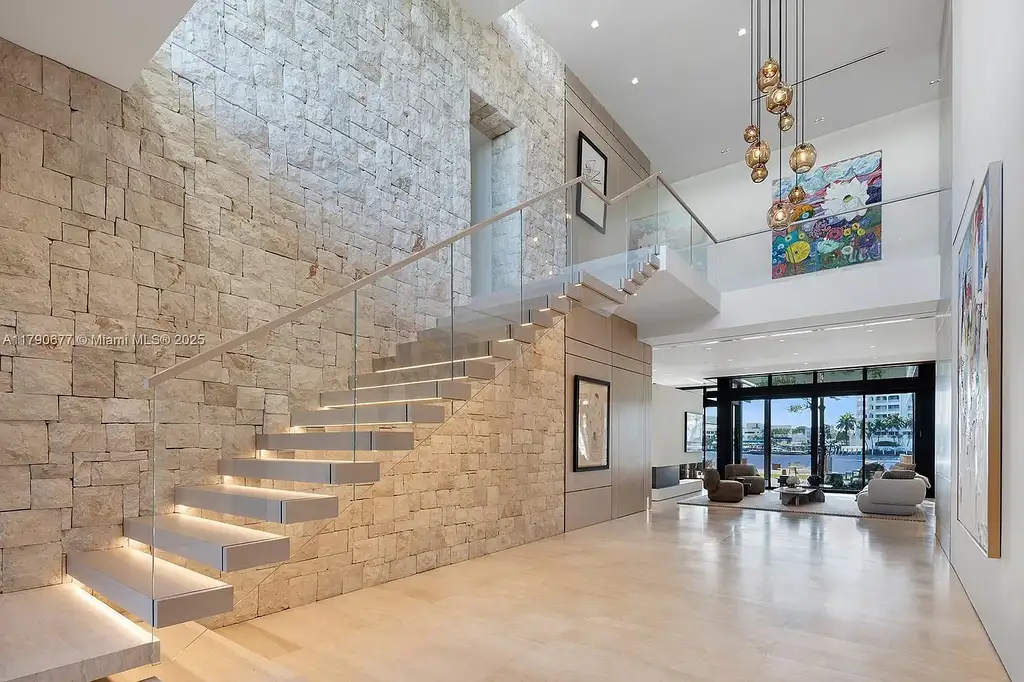 194 S Island Dr Golden Beach FL – Modern waterfront estate with Iroko wood and hand-placed stone facade, listed for $35 million