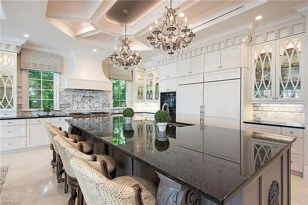 Luxury waterfront estate at 233 Mermaids Bight, featuring panoramic bay views, private dock, and elegant design in Park Shore, Naples.
