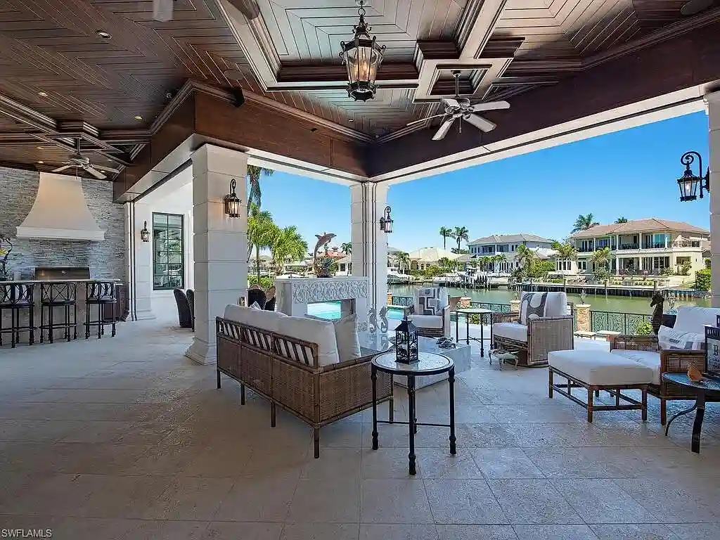 Luxury waterfront estate at 233 Mermaids Bight, featuring panoramic bay views, private dock, and elegant design in Park Shore, Naples.