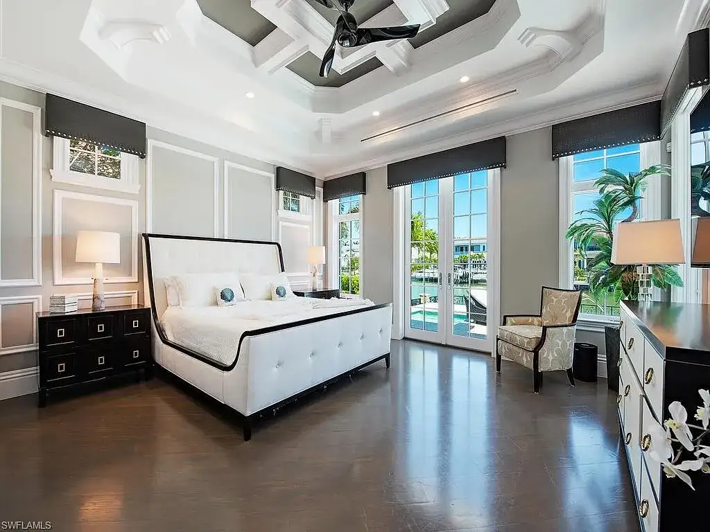 Luxury waterfront estate at 233 Mermaids Bight, featuring panoramic bay views, private dock, and elegant design in Park Shore, Naples.