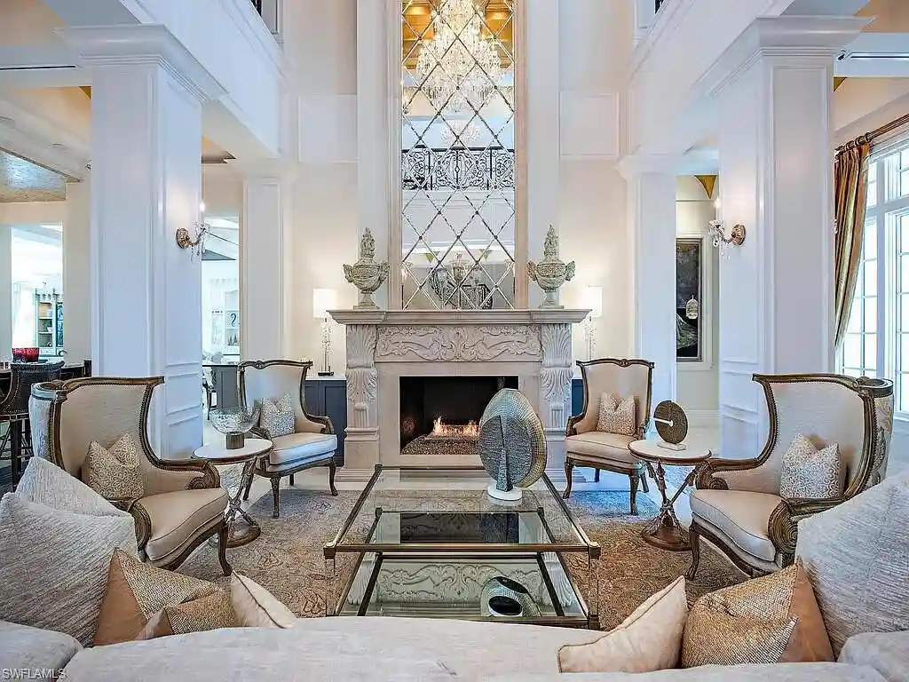 Luxury waterfront estate at 233 Mermaids Bight, featuring panoramic bay views, private dock, and elegant design in Park Shore, Naples.