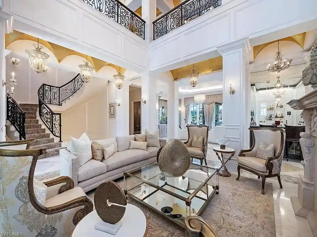 Luxury waterfront estate at 233 Mermaids Bight, featuring panoramic bay views, private dock, and elegant design in Park Shore, Naples.