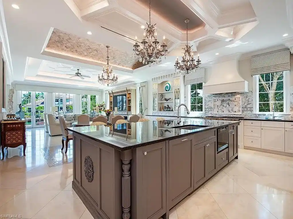 Luxury waterfront estate at 233 Mermaids Bight, featuring panoramic bay views, private dock, and elegant design in Park Shore, Naples.