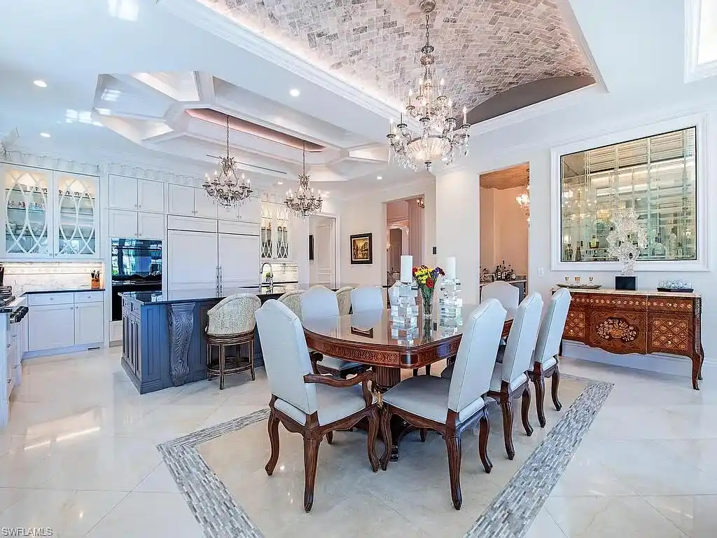 Luxury waterfront estate at 233 Mermaids Bight, featuring panoramic bay views, private dock, and elegant design in Park Shore, Naples.