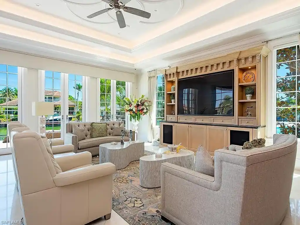 Luxury waterfront estate at 233 Mermaids Bight, featuring panoramic bay views, private dock, and elegant design in Park Shore, Naples.