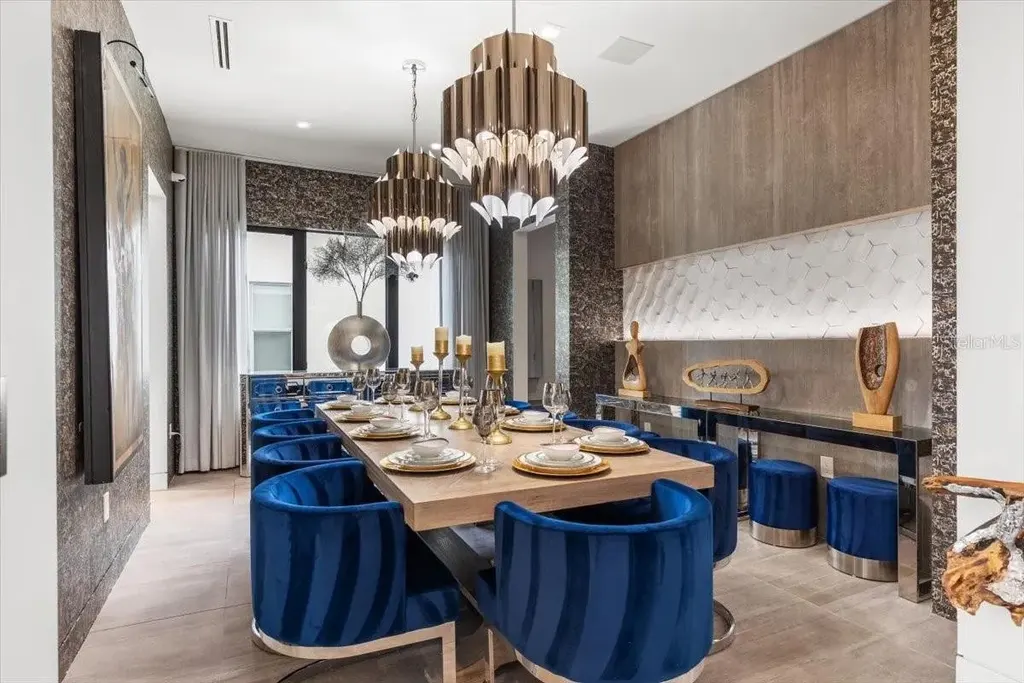 Luxury waterfront estate at 5131 W Neptune Way, Tampa featuring modern architecture, private dock, saltwater pool, rooftop terrace, and smart home technology