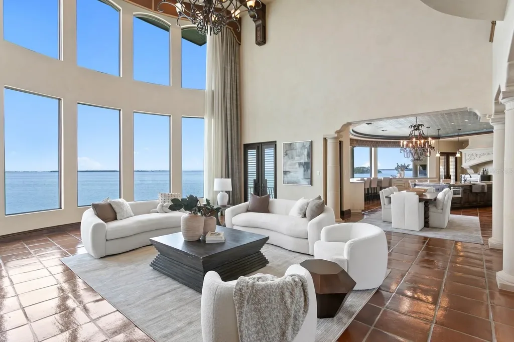 Luxury Mediterranean waterfront estate at 100 Sands Point Dr in Tierra Verde, FL, featuring private dock, saltwater pool, guest casita, and panoramic bay views