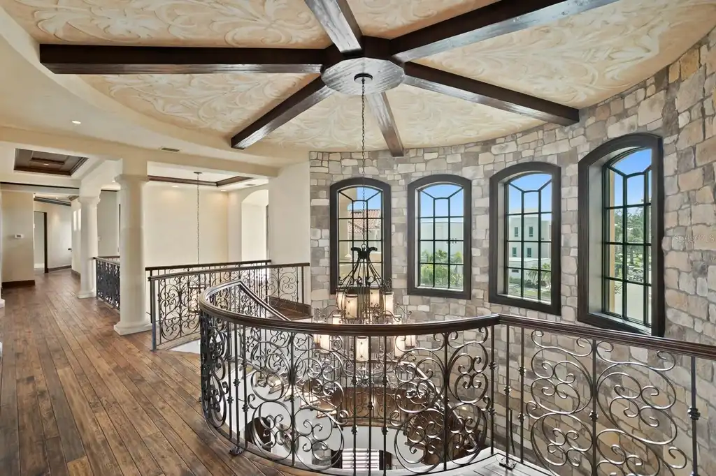 Luxury Mediterranean waterfront estate at 100 Sands Point Dr in Tierra Verde, FL, featuring private dock, saltwater pool, guest casita, and panoramic bay views