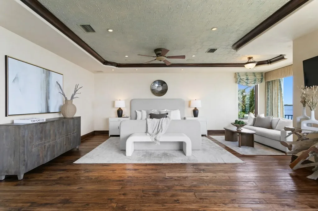 Luxury Mediterranean waterfront estate at 100 Sands Point Dr in Tierra Verde, FL, featuring private dock, saltwater pool, guest casita, and panoramic bay views