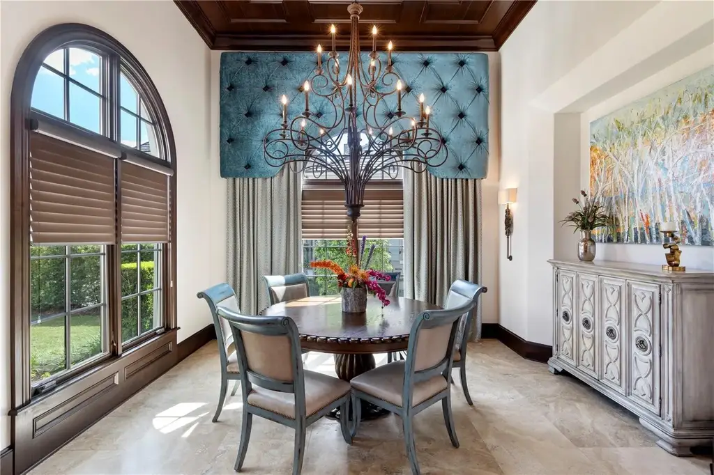 Front view of 10138 Enchanted Oak Dr showcasing Mediterranean architecture and lush landscaping in Orlando Real Estate.