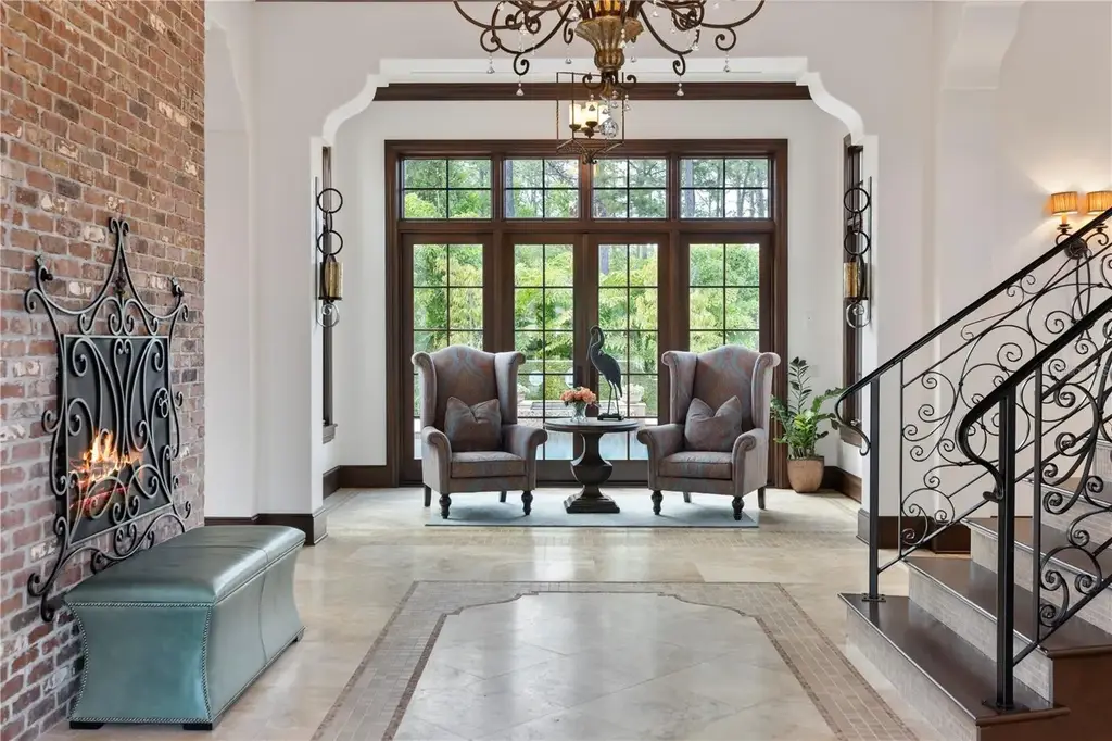 Front view of 10138 Enchanted Oak Dr showcasing Mediterranean architecture and lush landscaping in Orlando Real Estate.