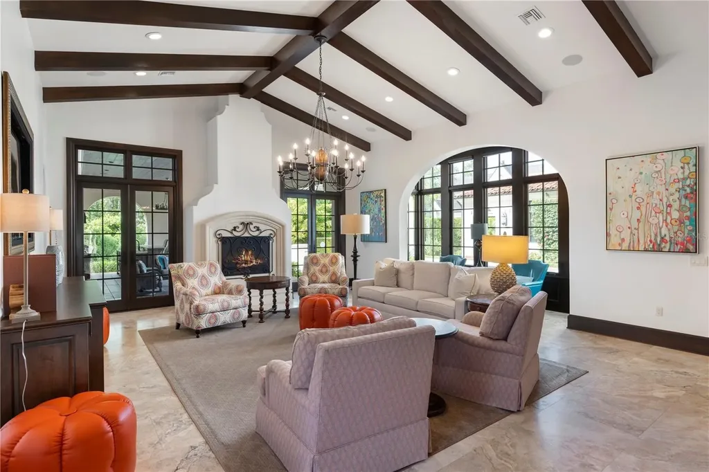 Front view of 10138 Enchanted Oak Dr showcasing Mediterranean architecture and lush landscaping in Orlando Real Estate.
