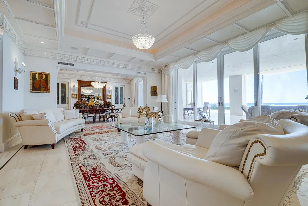 Italian-inspired luxury mansion at 1280 S Ocean Boulevard in Manalapan with waterfront frontage and lush landscaping