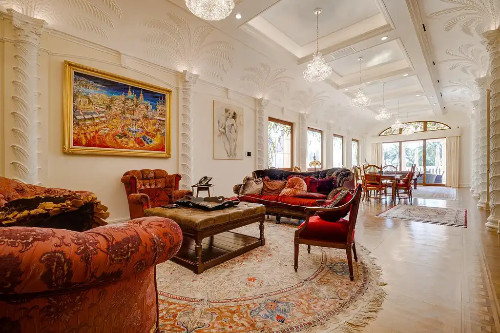 Italian-inspired luxury mansion at 1280 S Ocean Boulevard in Manalapan with waterfront frontage and lush landscaping