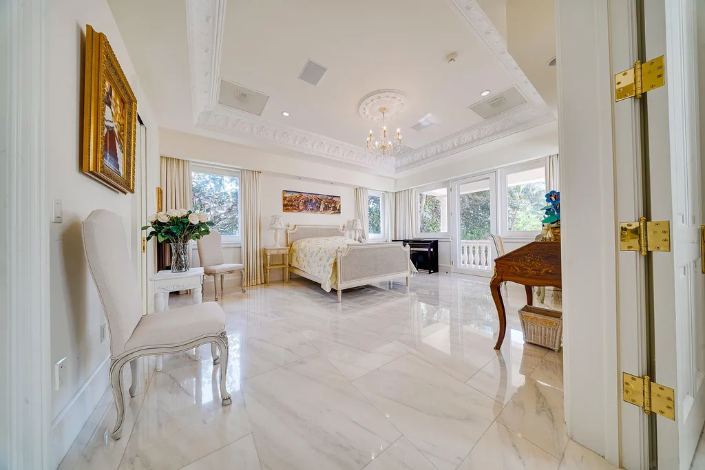 Italian-inspired luxury mansion at 1280 S Ocean Boulevard in Manalapan with waterfront frontage and lush landscaping