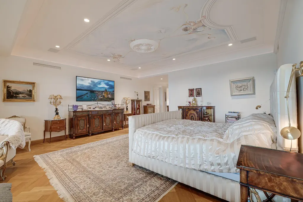 Italian-inspired luxury mansion at 1280 S Ocean Boulevard in Manalapan with waterfront frontage and lush landscaping