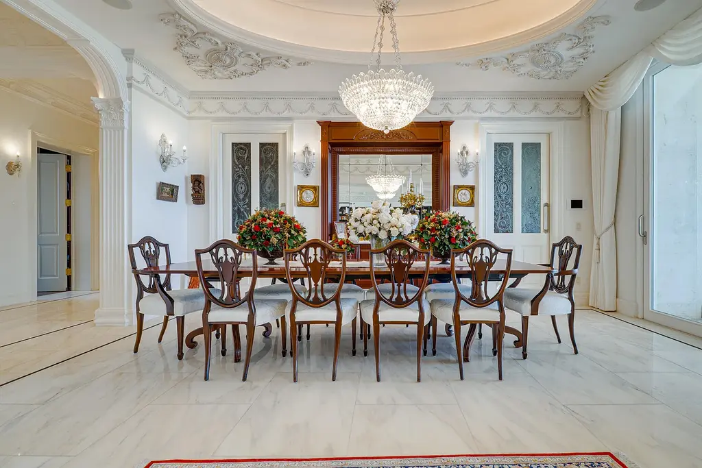 Italian-inspired luxury mansion at 1280 S Ocean Boulevard in Manalapan with waterfront frontage and lush landscaping