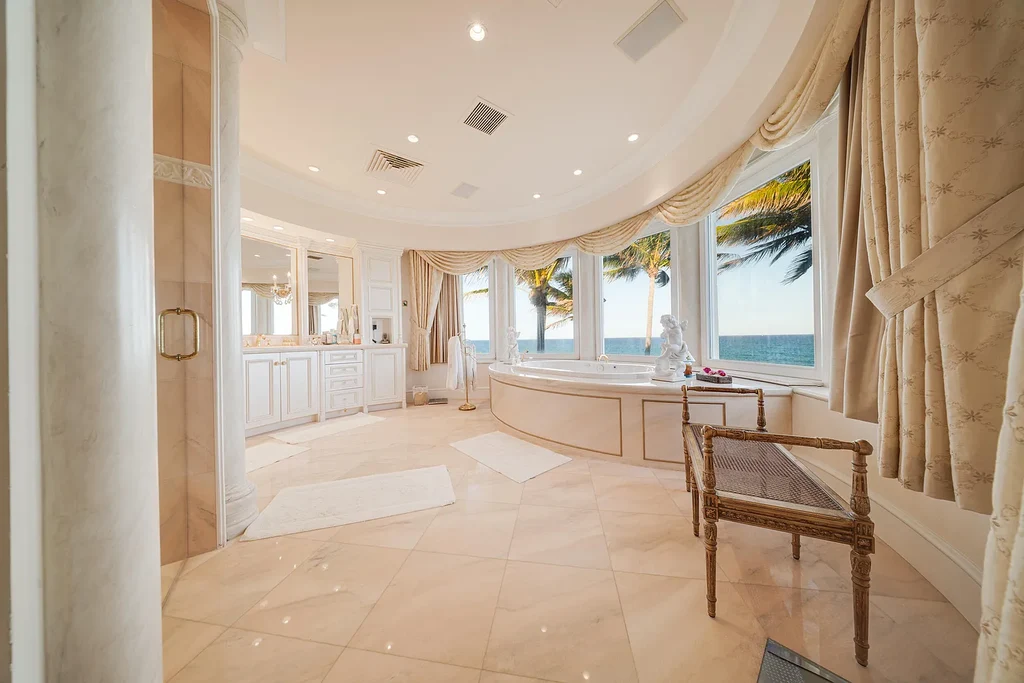 Italian-inspired luxury mansion at 1280 S Ocean Boulevard in Manalapan with waterfront frontage and lush landscaping