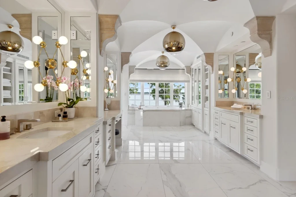 Luxurious Mediterranean estate at 1640 E Adams Dr in Maitland, featuring a grand motor court and lush landscaping