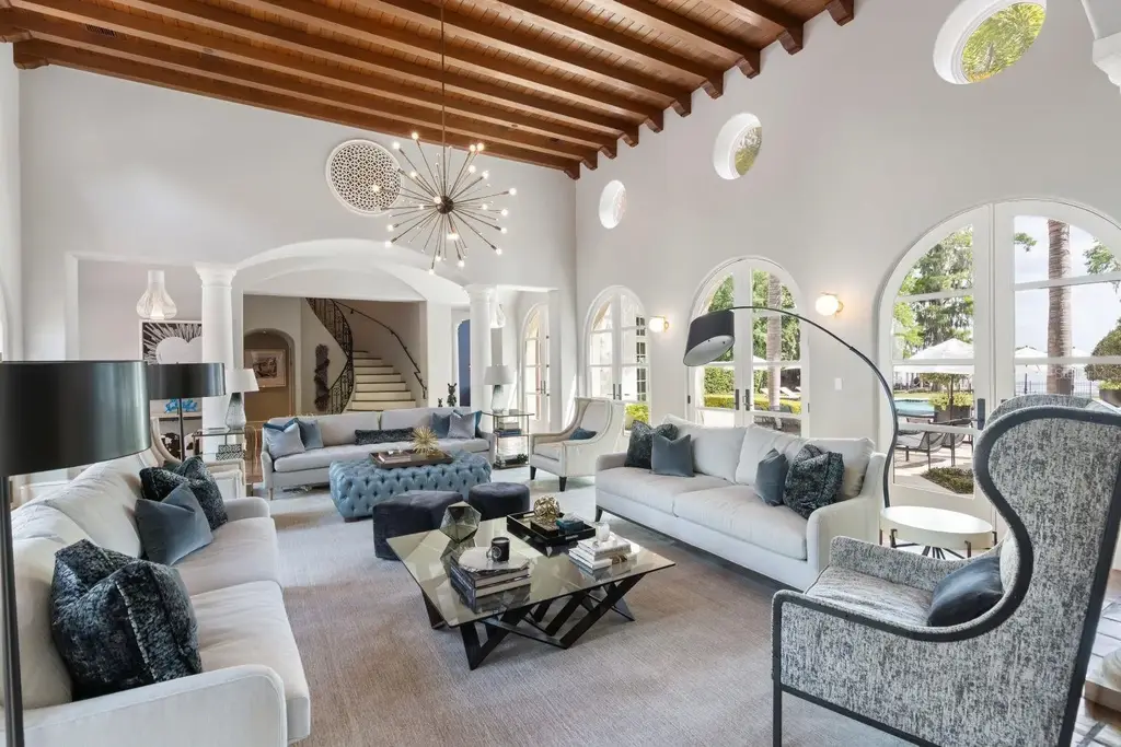 Luxurious Mediterranean estate at 1640 E Adams Dr in Maitland, featuring a grand motor court and lush landscaping