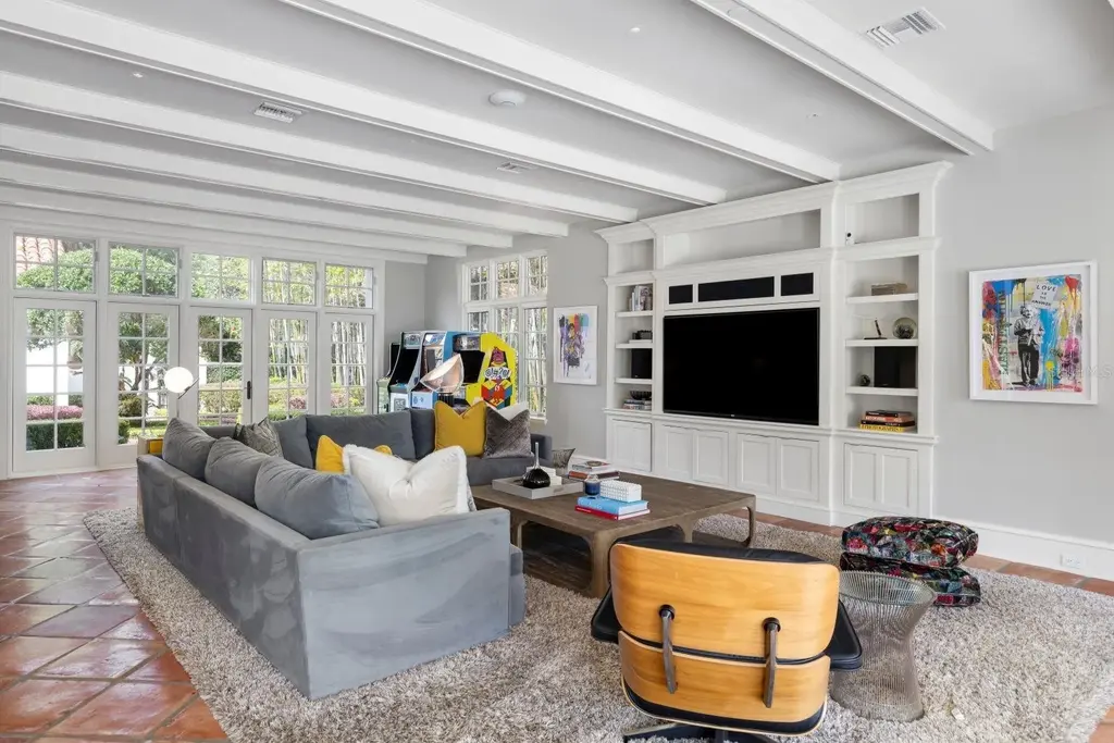 Luxurious Mediterranean estate at 1640 E Adams Dr in Maitland, featuring a grand motor court and lush landscaping