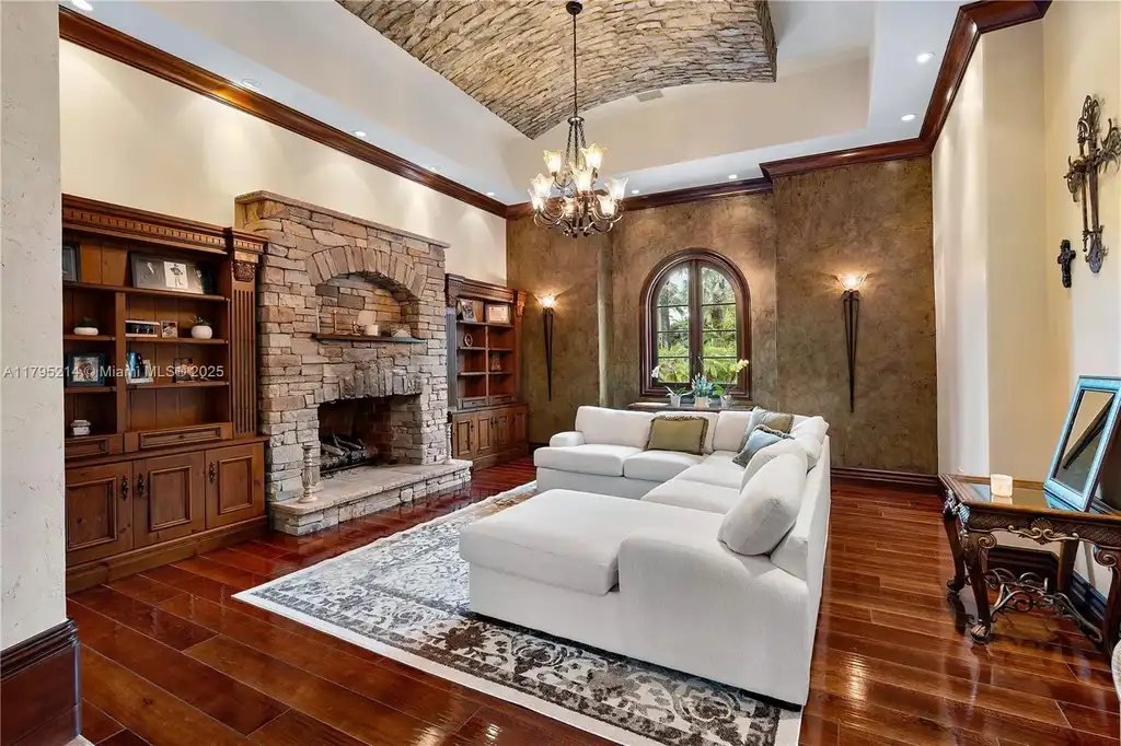 Elegant living room with high ceilings and Crestron smart home system at 17201 SW 248th St in Homestead, FL