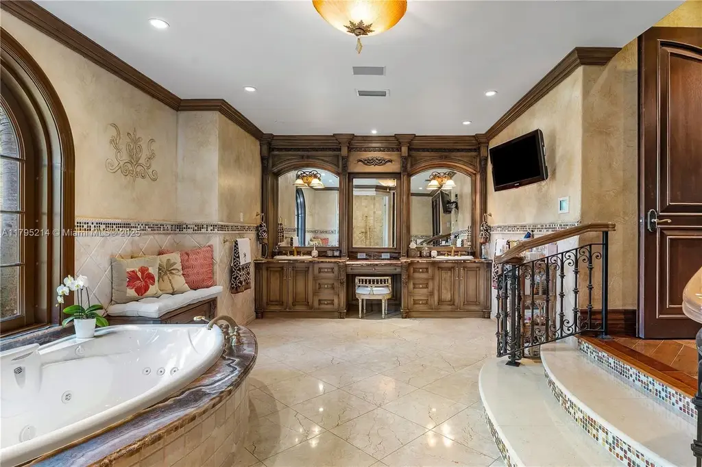 Elegant living room with high ceilings and Crestron smart home system at 17201 SW 248th St in Homestead, FL