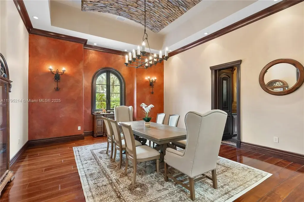 Elegant living room with high ceilings and Crestron smart home system at 17201 SW 248th St in Homestead, FL