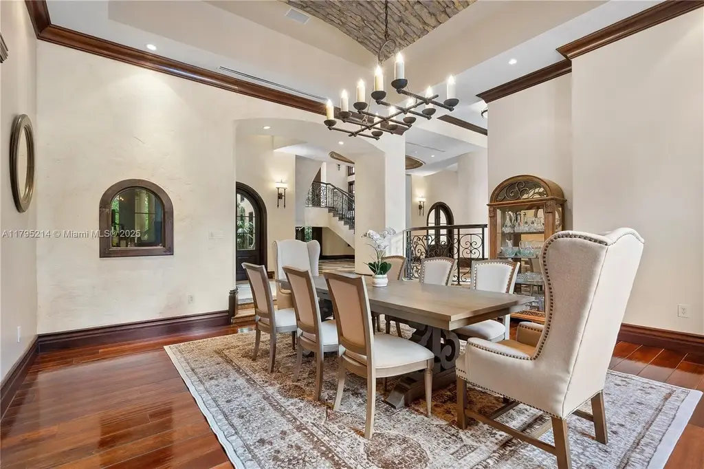 Elegant living room with high ceilings and Crestron smart home system at 17201 SW 248th St in Homestead, FL