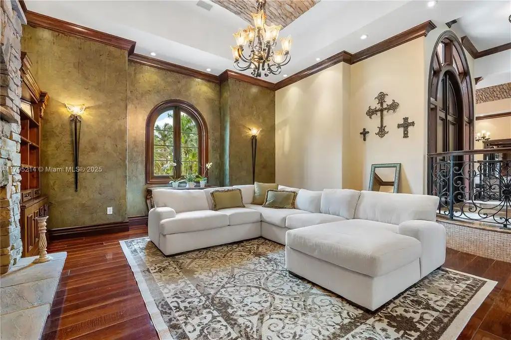 Elegant living room with high ceilings and Crestron smart home system at 17201 SW 248th St in Homestead, FL