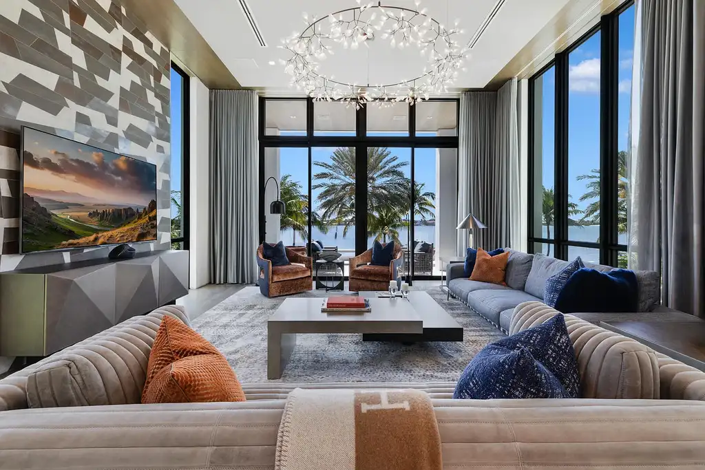 Front view of the $84.9M luxury mansion at 1940 S Ocean Boulevard in Manalapan, Florida, featuring oceanfront design, infinity pool, and private dock access.