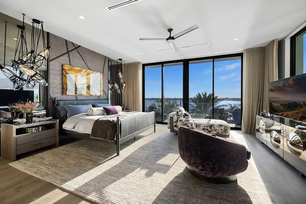 Front view of the $84.9M luxury mansion at 1940 S Ocean Boulevard in Manalapan, Florida, featuring oceanfront design, infinity pool, and private dock access.