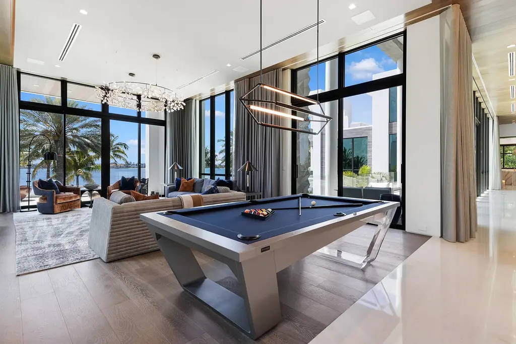 Front view of the $84.9M luxury mansion at 1940 S Ocean Boulevard in Manalapan, Florida, featuring oceanfront design, infinity pool, and private dock access.