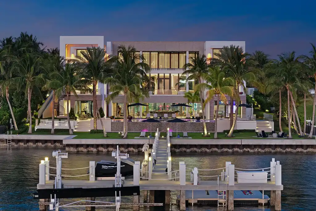 Front view of the $84.9M luxury mansion at 1940 S Ocean Boulevard in Manalapan, Florida, featuring oceanfront design, infinity pool, and private dock access.