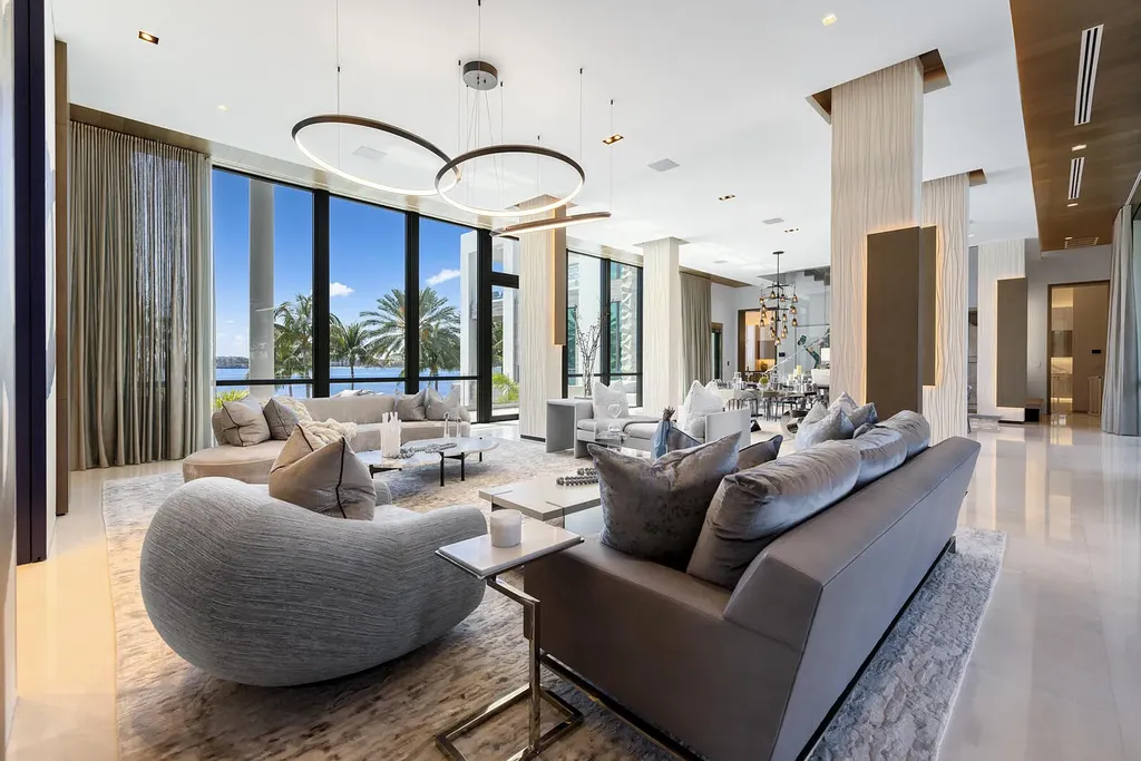 Front view of the $84.9M luxury mansion at 1940 S Ocean Boulevard in Manalapan, Florida, featuring oceanfront design, infinity pool, and private dock access.