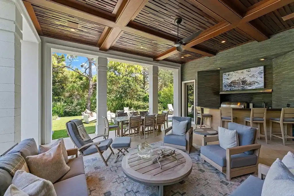 Front exterior view of the luxury $24.5M estate at 232 Bears Club Drive in Jupiter, Florida, showcasing Mediterranean architecture, manicured landscaping, and golf course frontage.